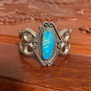 Vintage Navajo sandcast sterling silver bracelet with natural turquoise stone